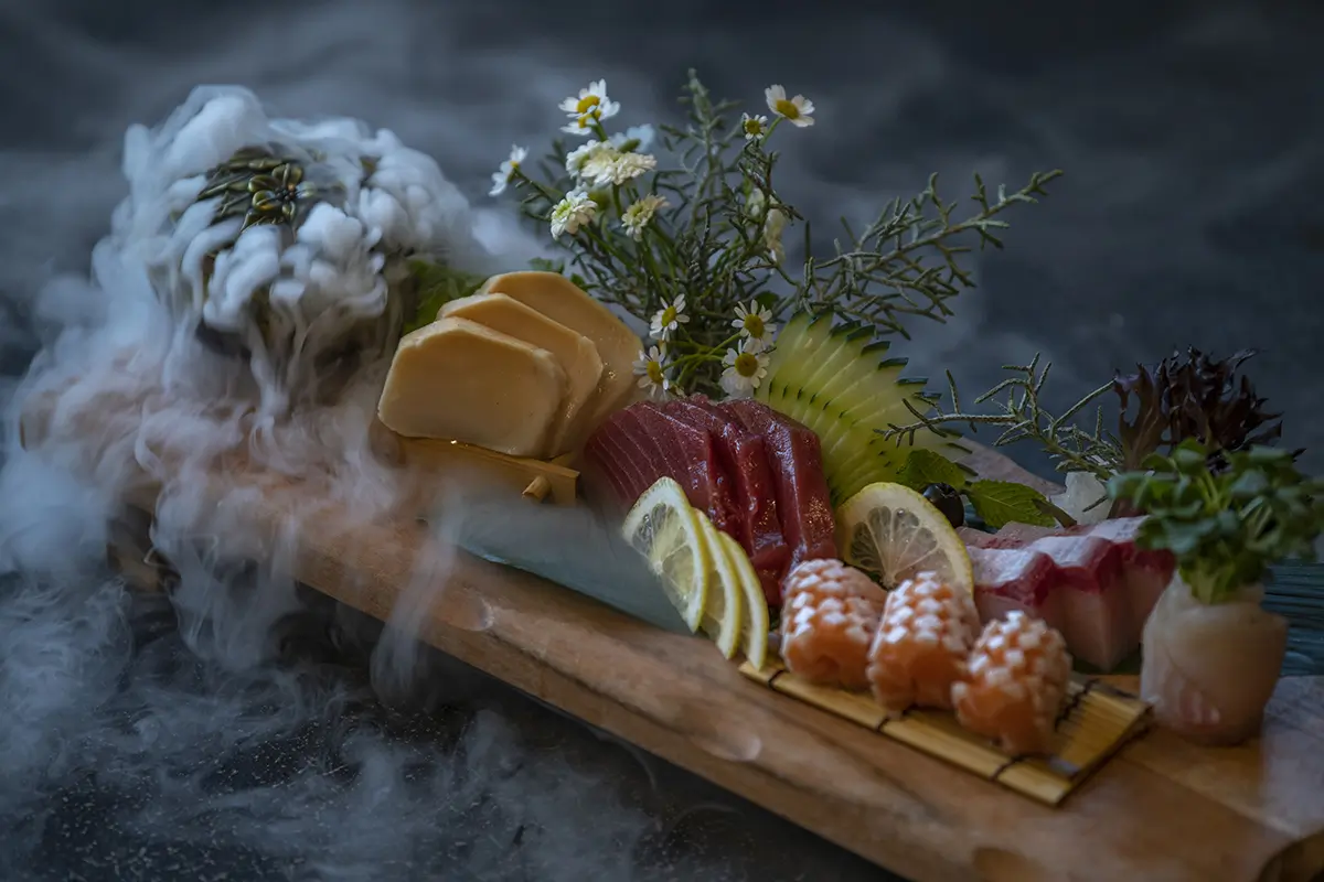 Sashimi platter with dry ice smoke, garnished with flowers at Shiki Sushi，a Japanese Restaurant in Santa Rosa